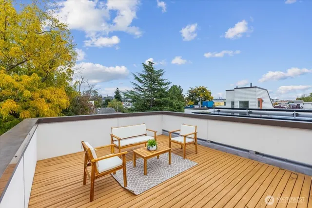 a view of sitting area with furniture and wooden floor