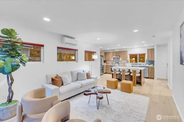 a living room with furniture and a potted plant