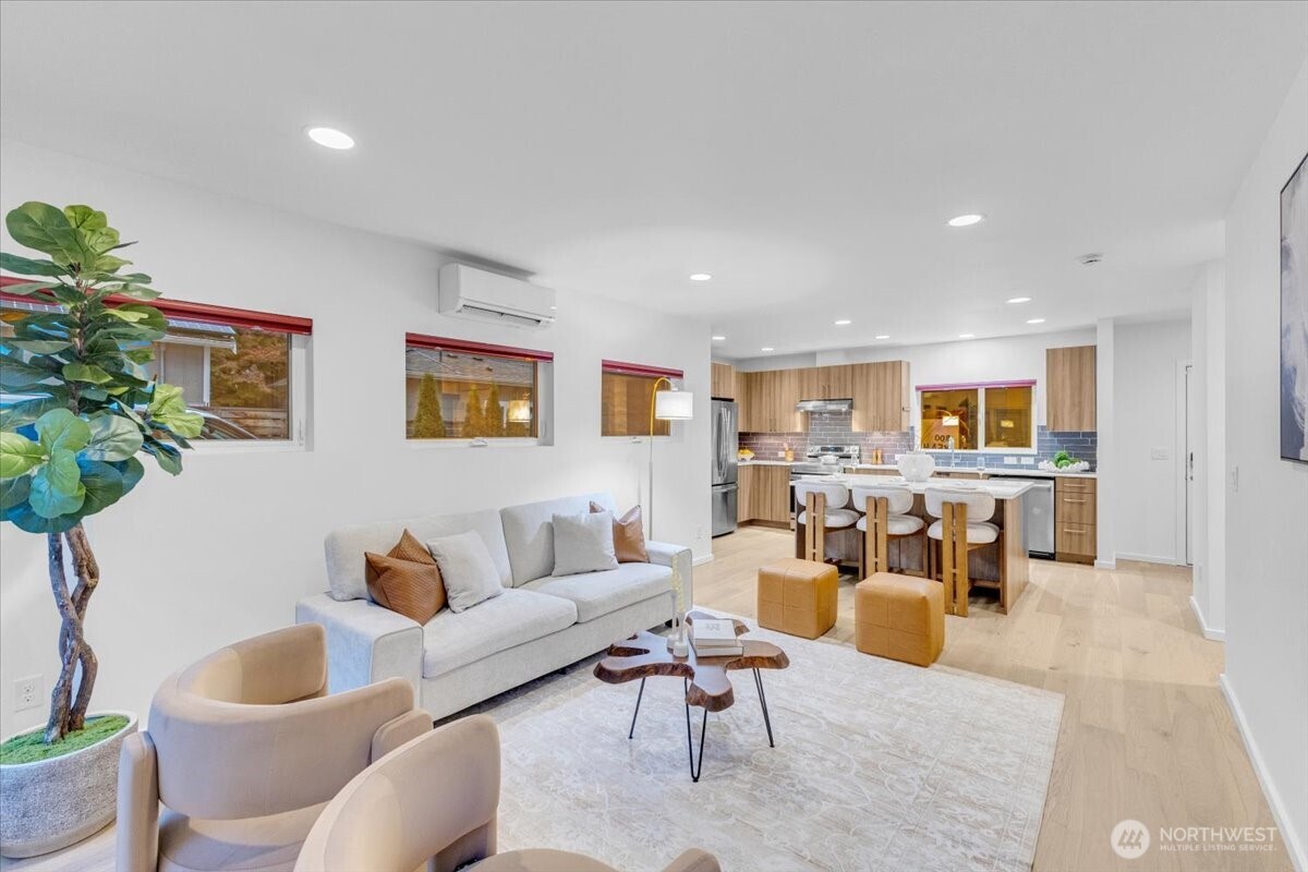 1722 Northwest 60th Street Seattle, WA 98107 - Photo 9 of 37 a living room with furniture and a potted plant