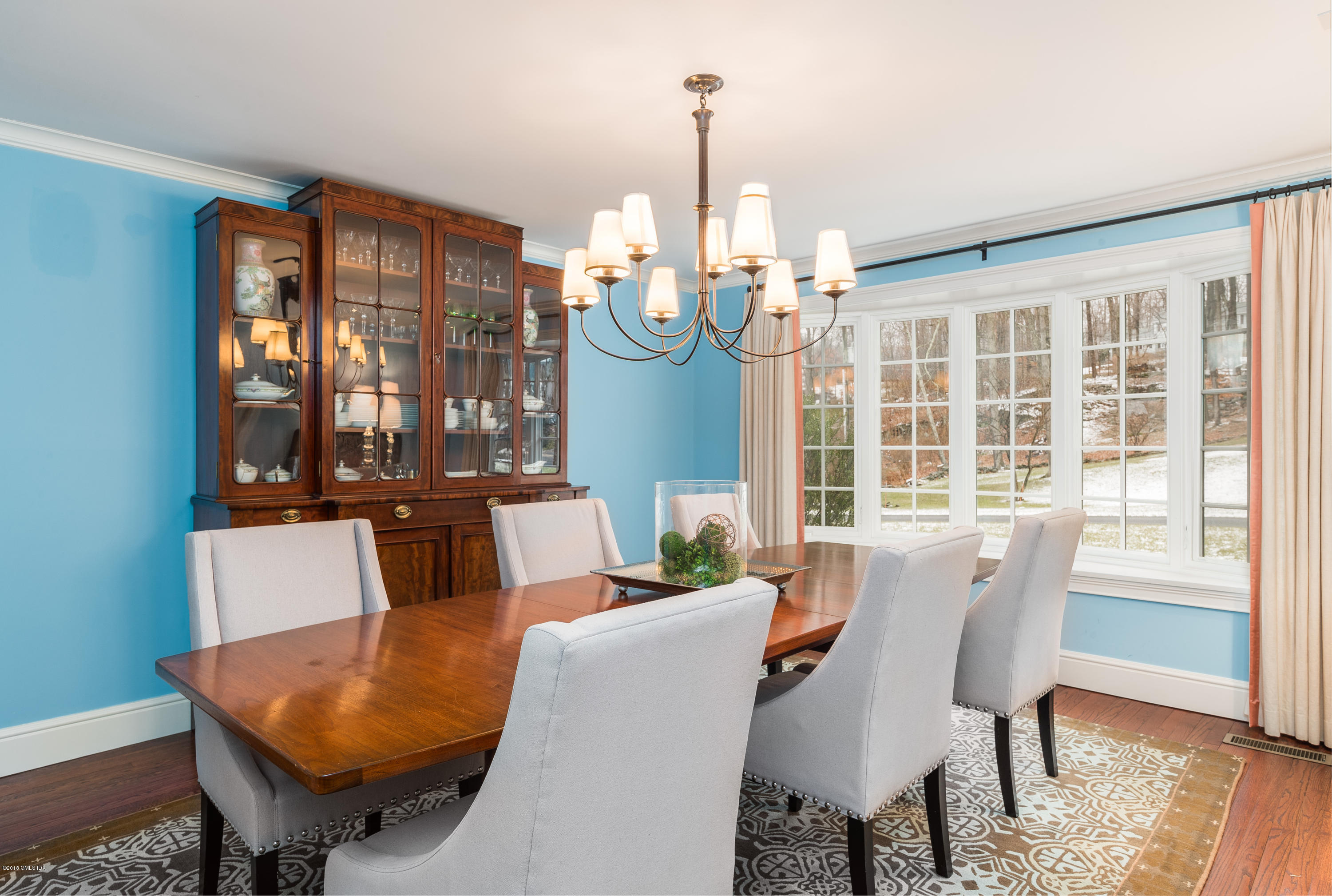 63 Burning Tree Road Greenwich, CT 06830 - Photo 13 of 40 a view of a dining room with furniture window and wooden floor