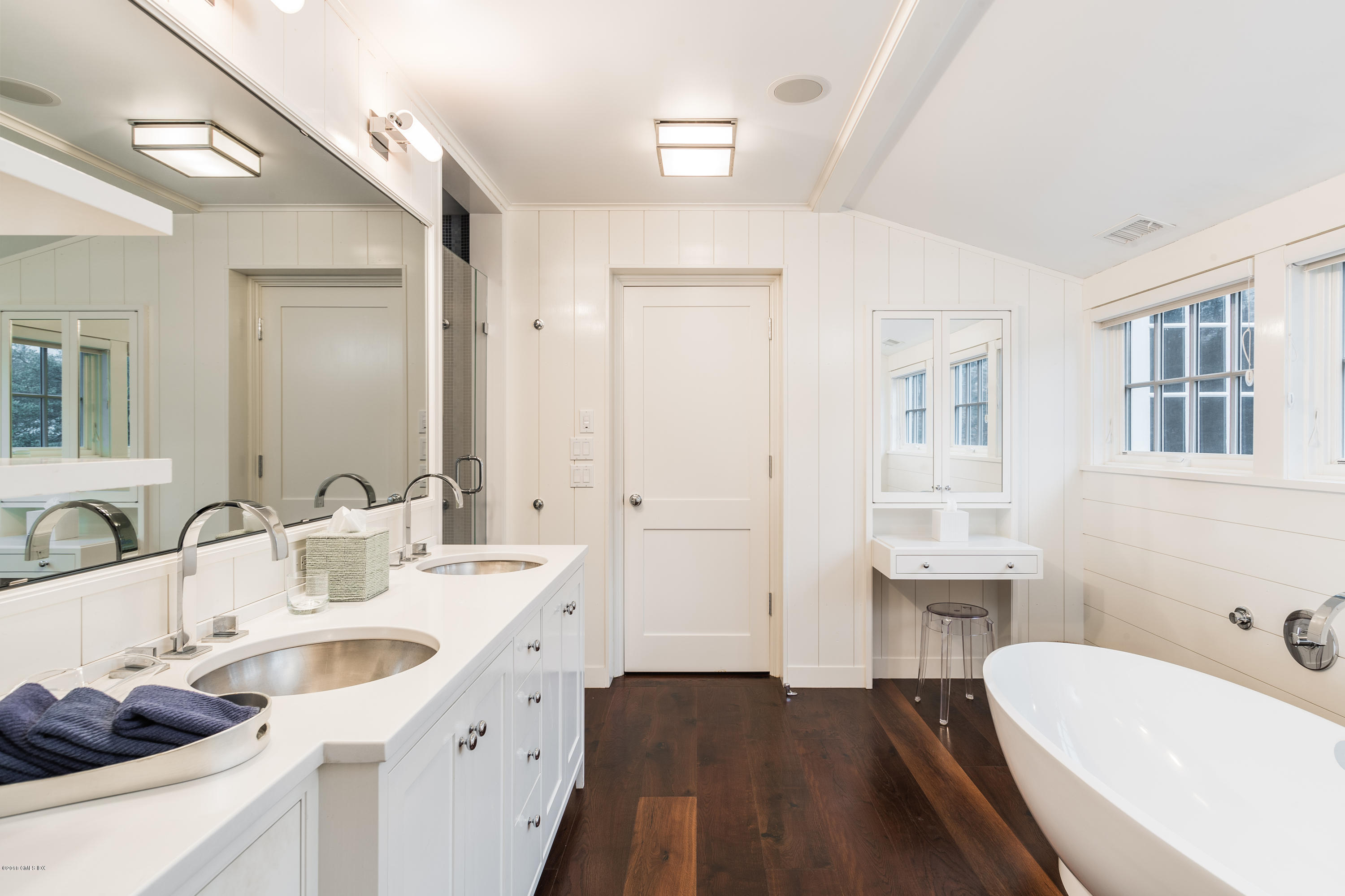 63 Burning Tree Road Greenwich, CT 06830 - Photo 21 of 40 a bathroom with a sink and a bathtub