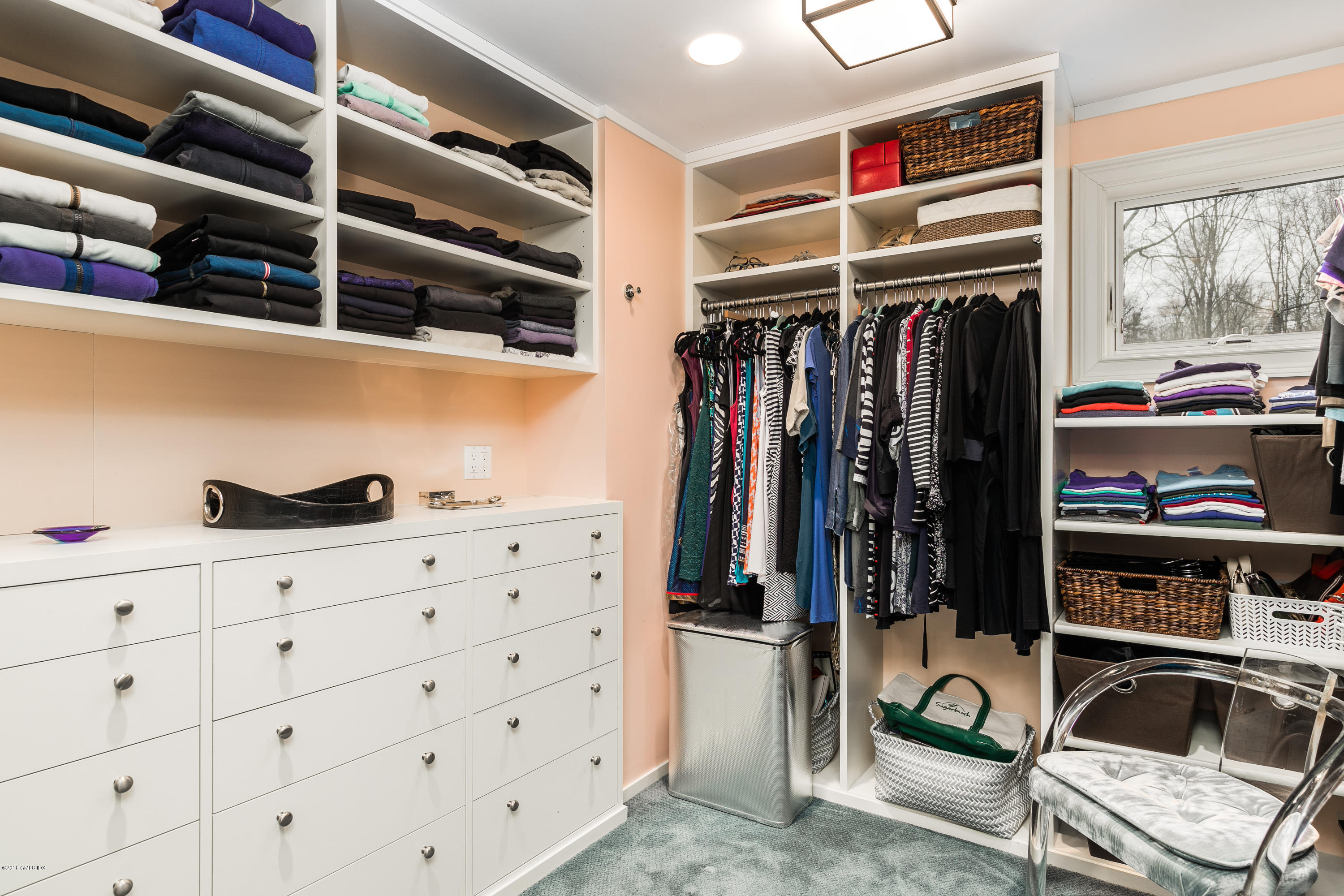 63 Burning Tree Road Greenwich, CT 06830 - Photo 22 of 40 a view of walk in closet with clothes and shoes