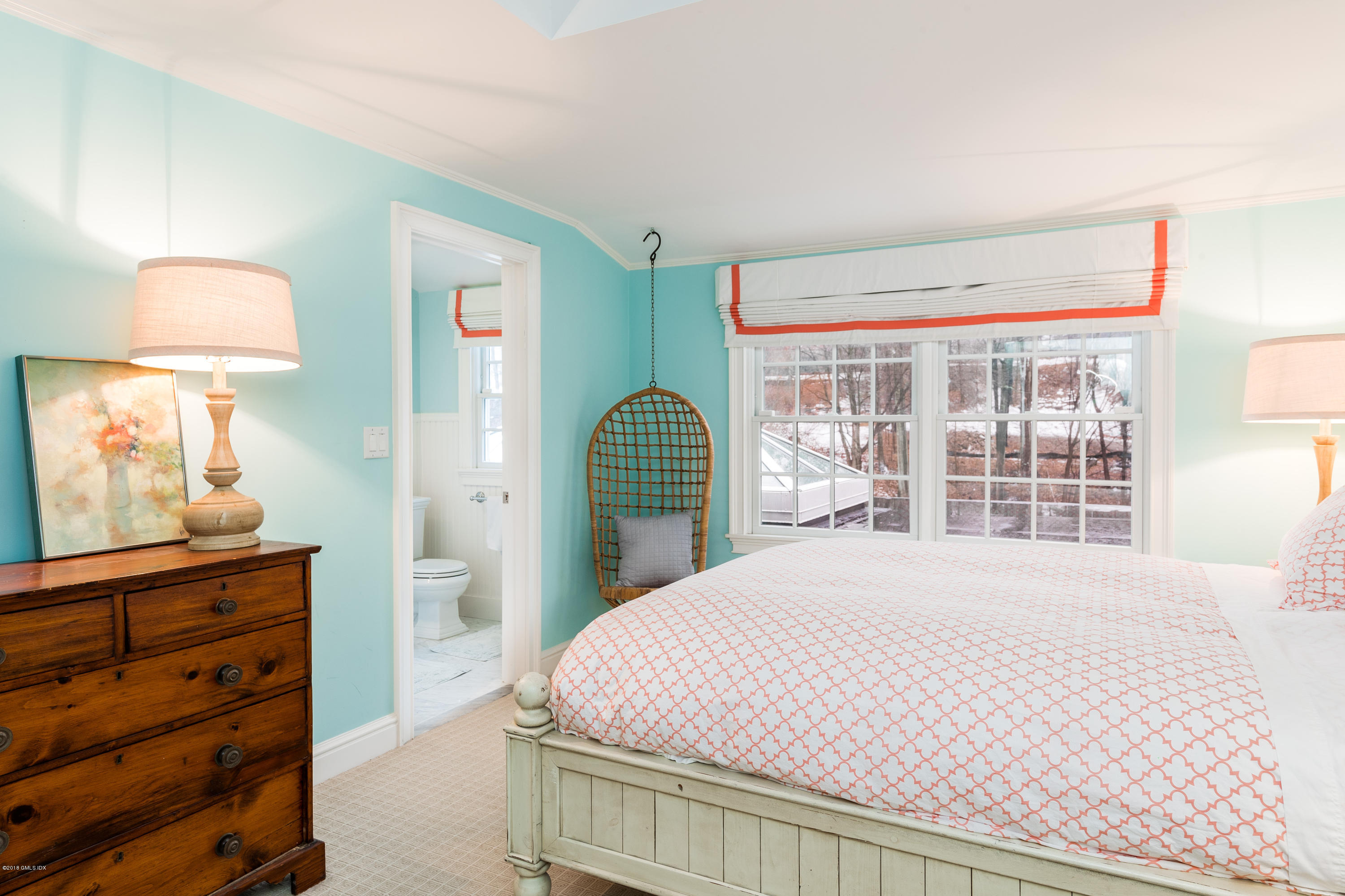 63 Burning Tree Road Greenwich, CT 06830 - Photo 28 of 40 a bedroom with a bed and a dresser