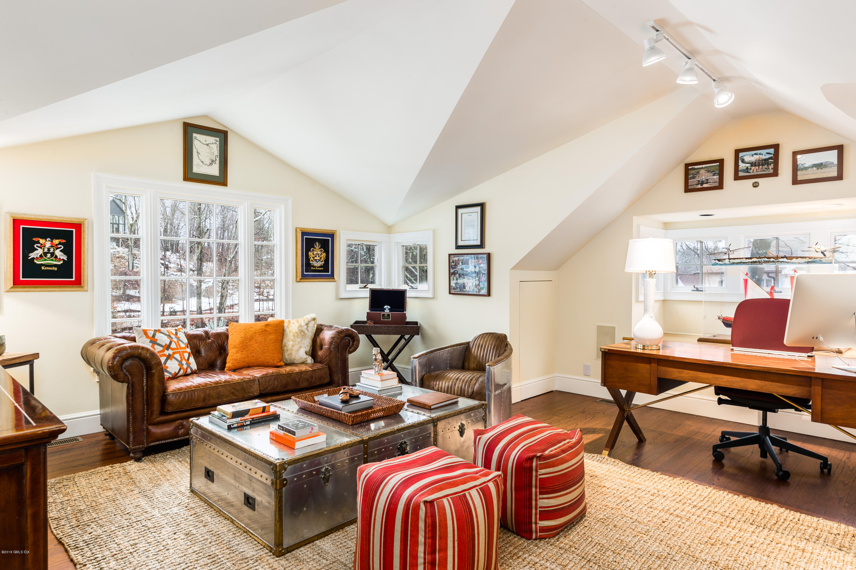 63 Burning Tree Road Greenwich, CT 06830 - Photo 29 of 40 a living room with furniture a rug and a window
