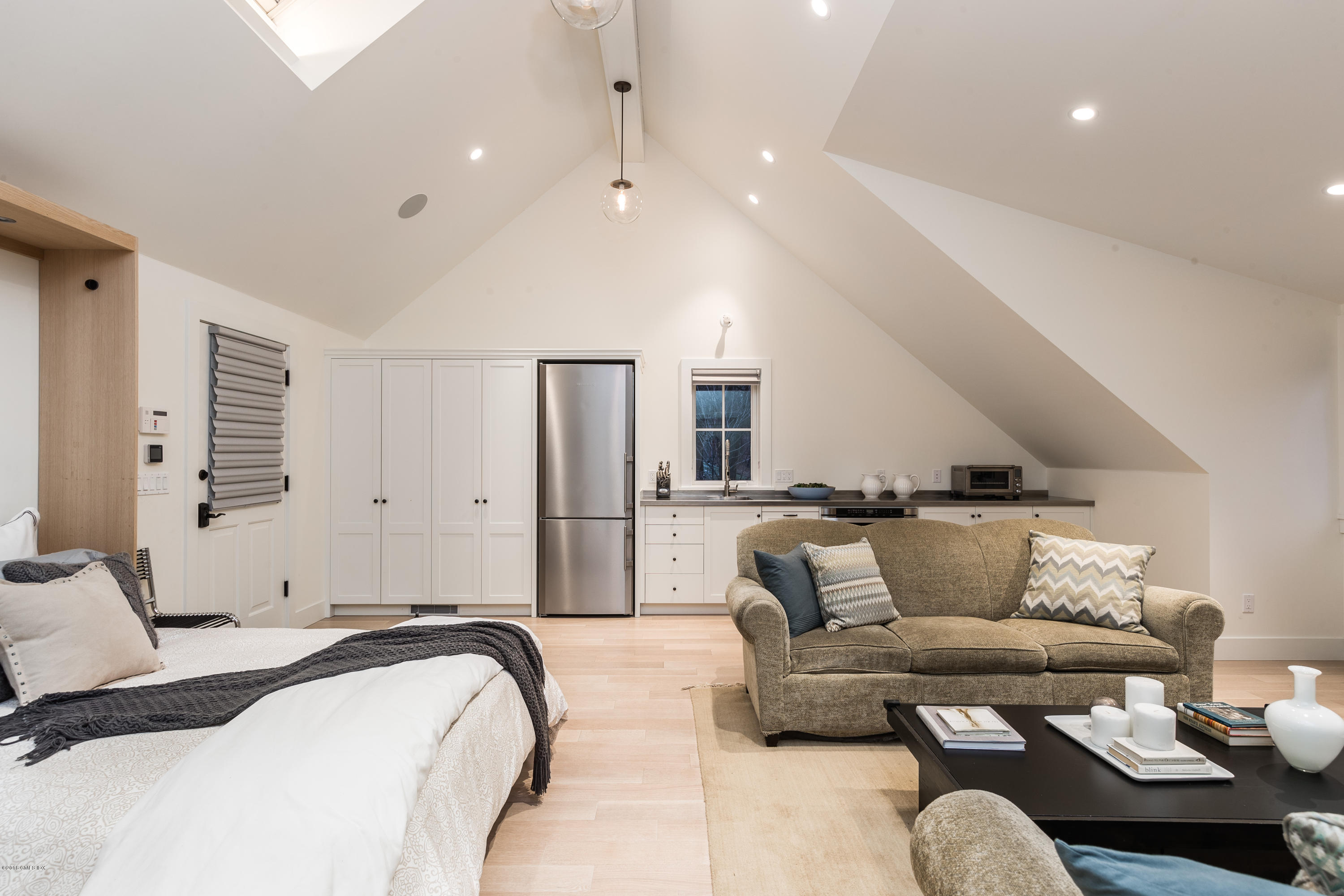 63 Burning Tree Road Greenwich, CT 06830 - Photo 31 of 40 a living room with furniture and a couch