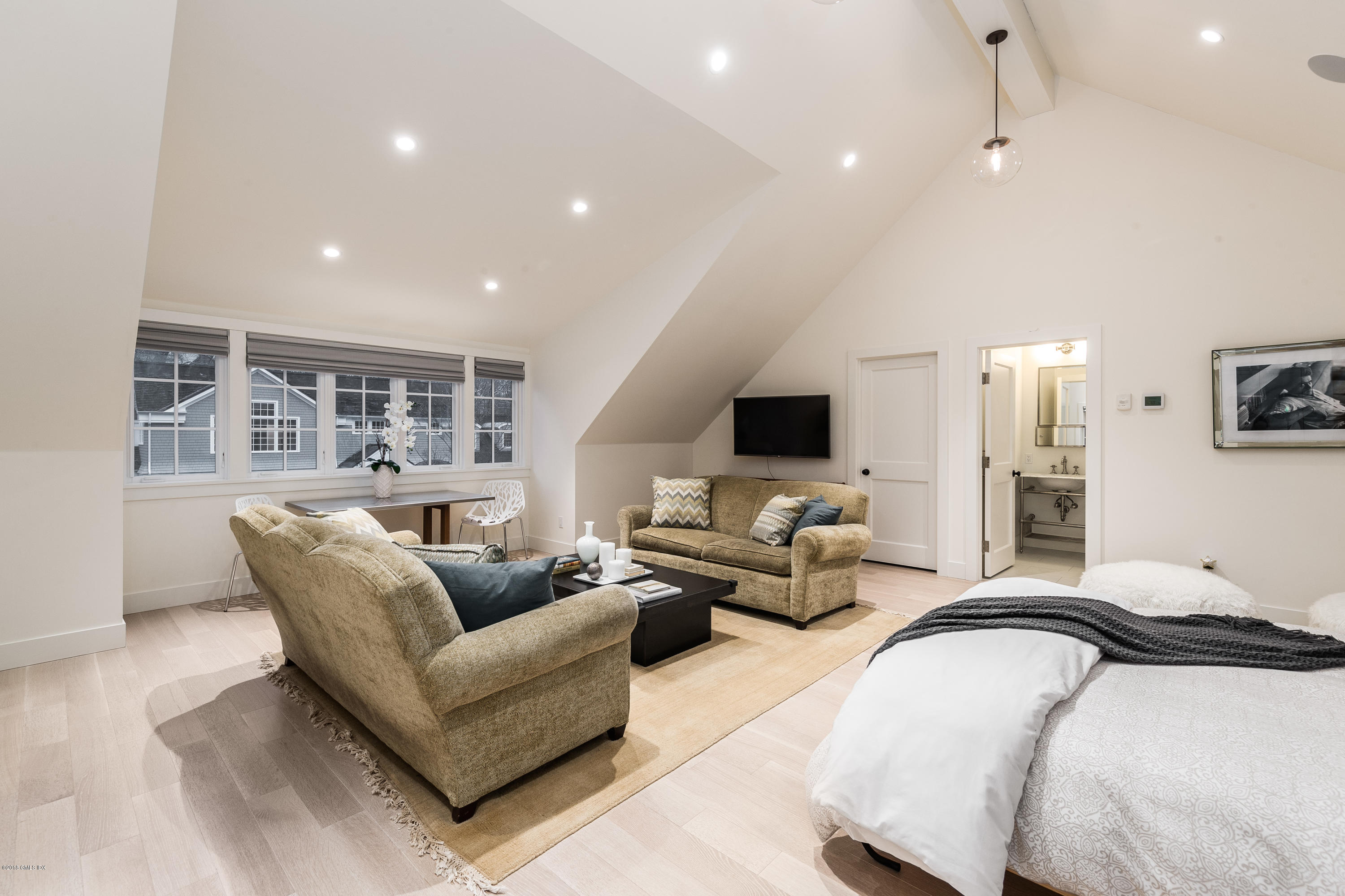 63 Burning Tree Road Greenwich, CT 06830 - Photo 32 of 40 a living room with furniture and a flat screen tv