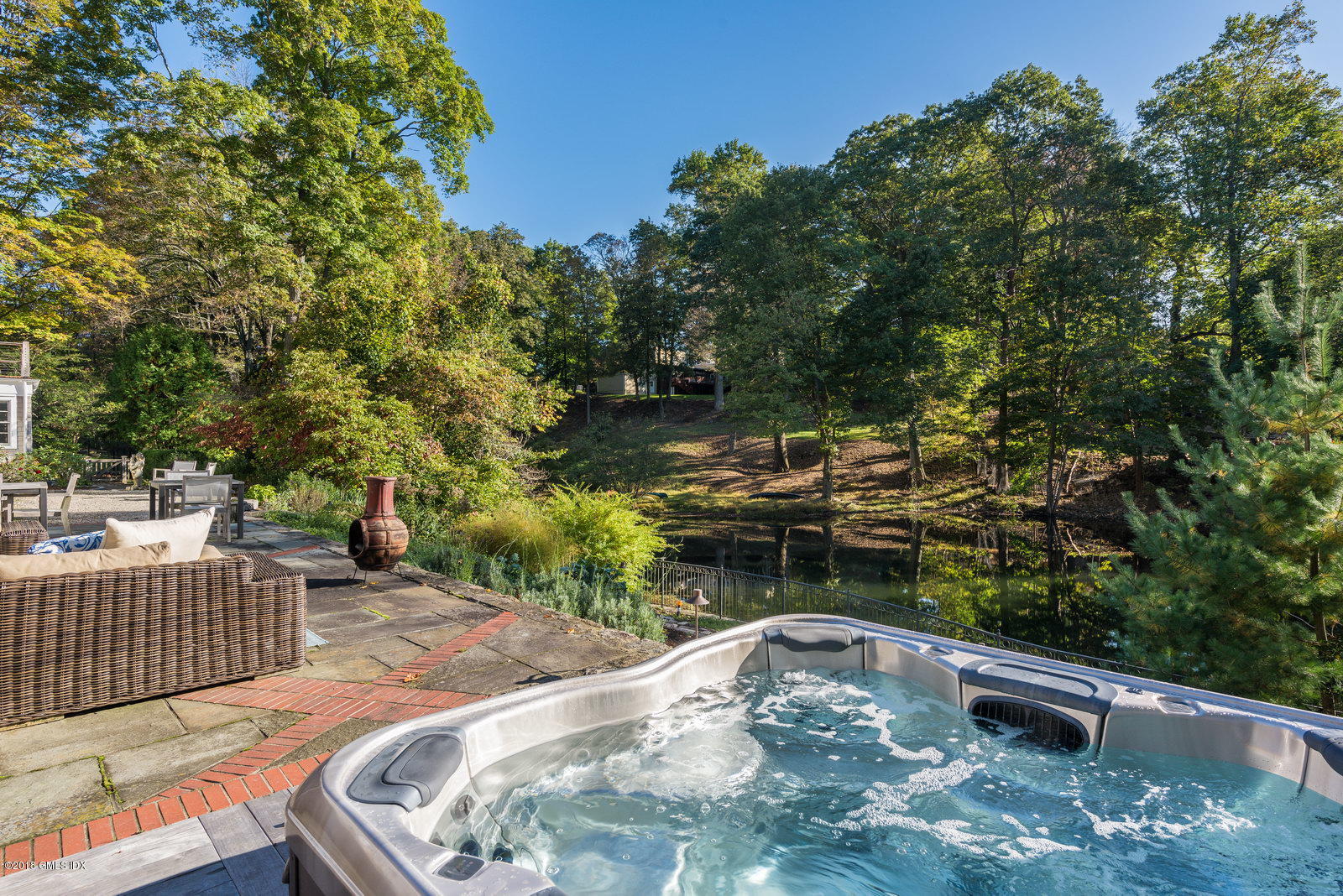 63 Burning Tree Road Greenwich, CT 06830 - Photo 33 of 40 a view of a backyard with sitting area