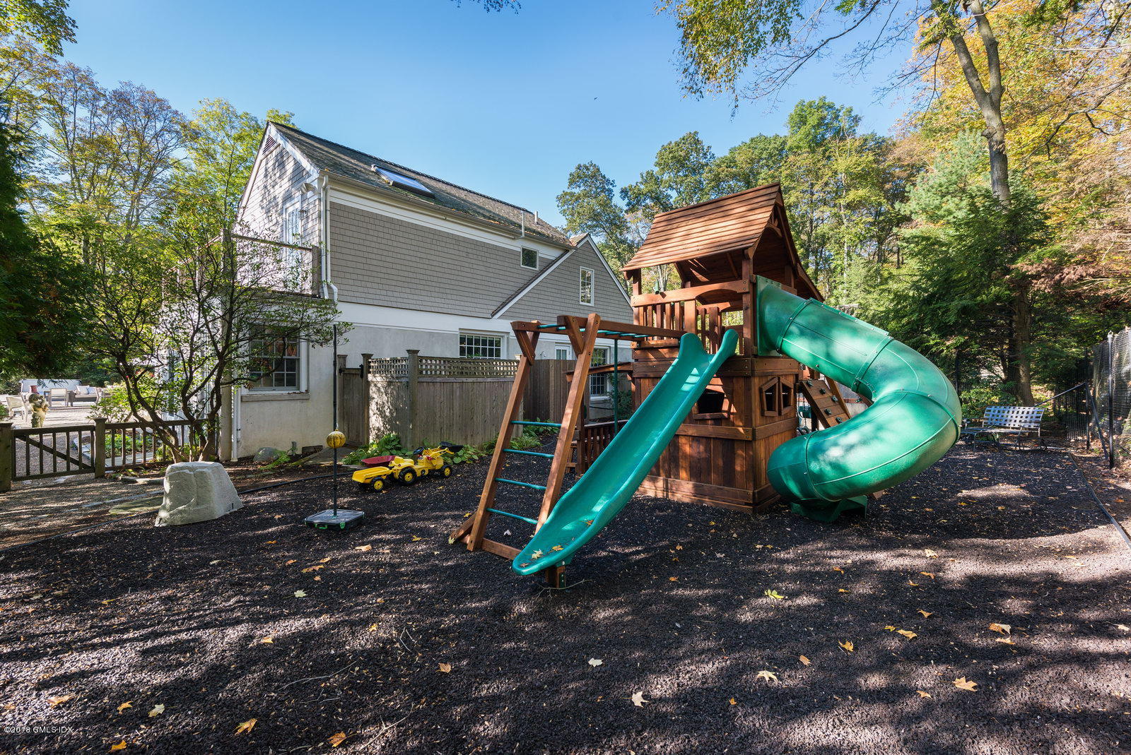 63 Burning Tree Road Greenwich, CT 06830 - Photo 37 of 40 a view of a backyard with a slide