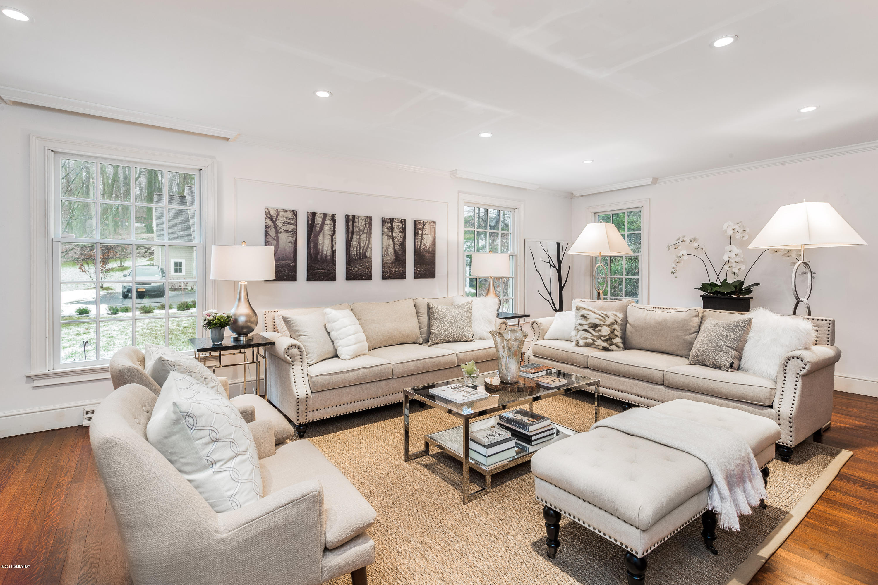 63 Burning Tree Road Greenwich, CT 06830 - Photo 5 of 40 a living room with furniture and a large window