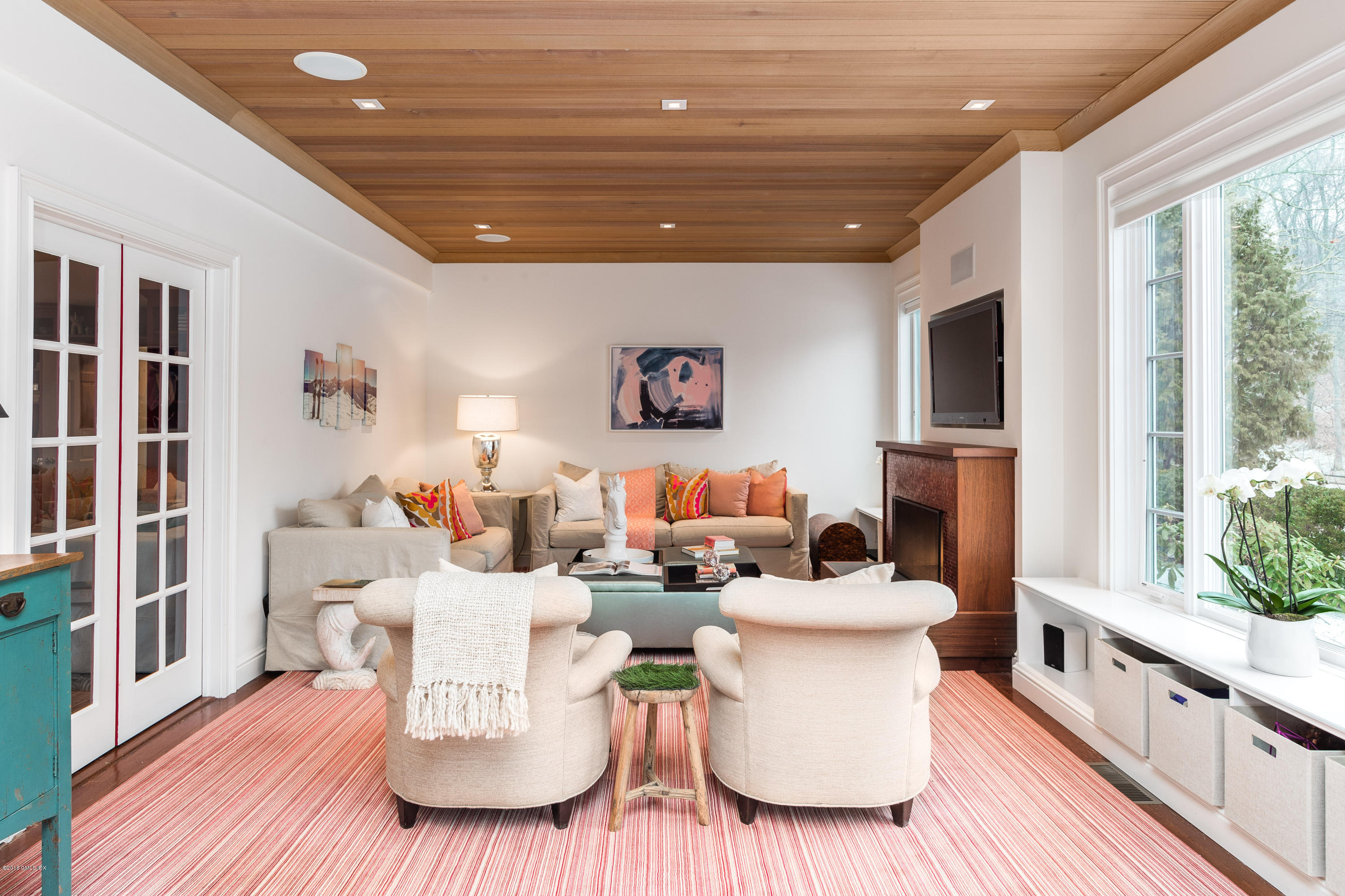 63 Burning Tree Road Greenwich, CT 06830 - Photo 6 of 40 a living room with furniture and a table