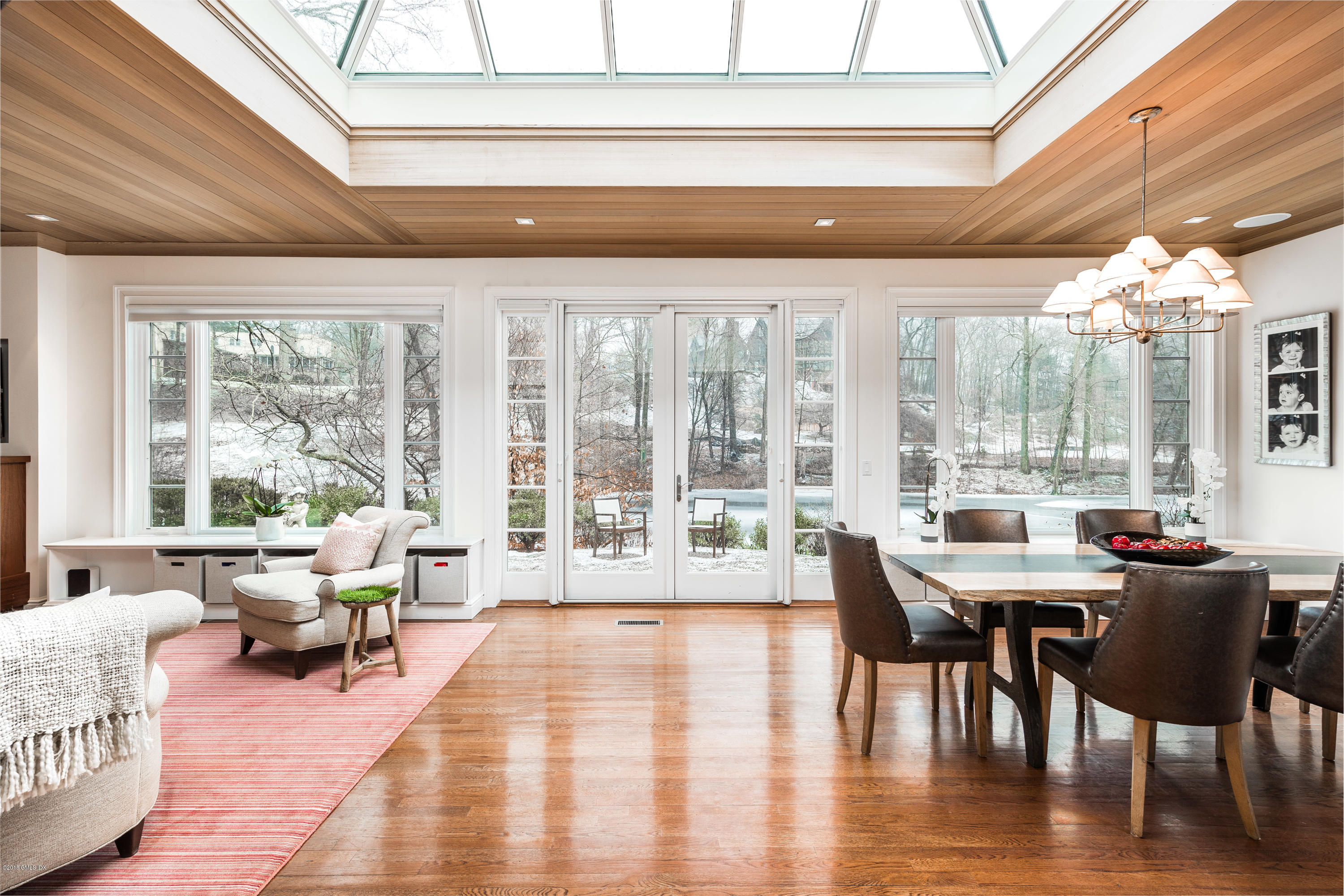 63 Burning Tree Road Greenwich, CT 06830 - Photo 7 of 40 a dining room with furniture window and wooden floor