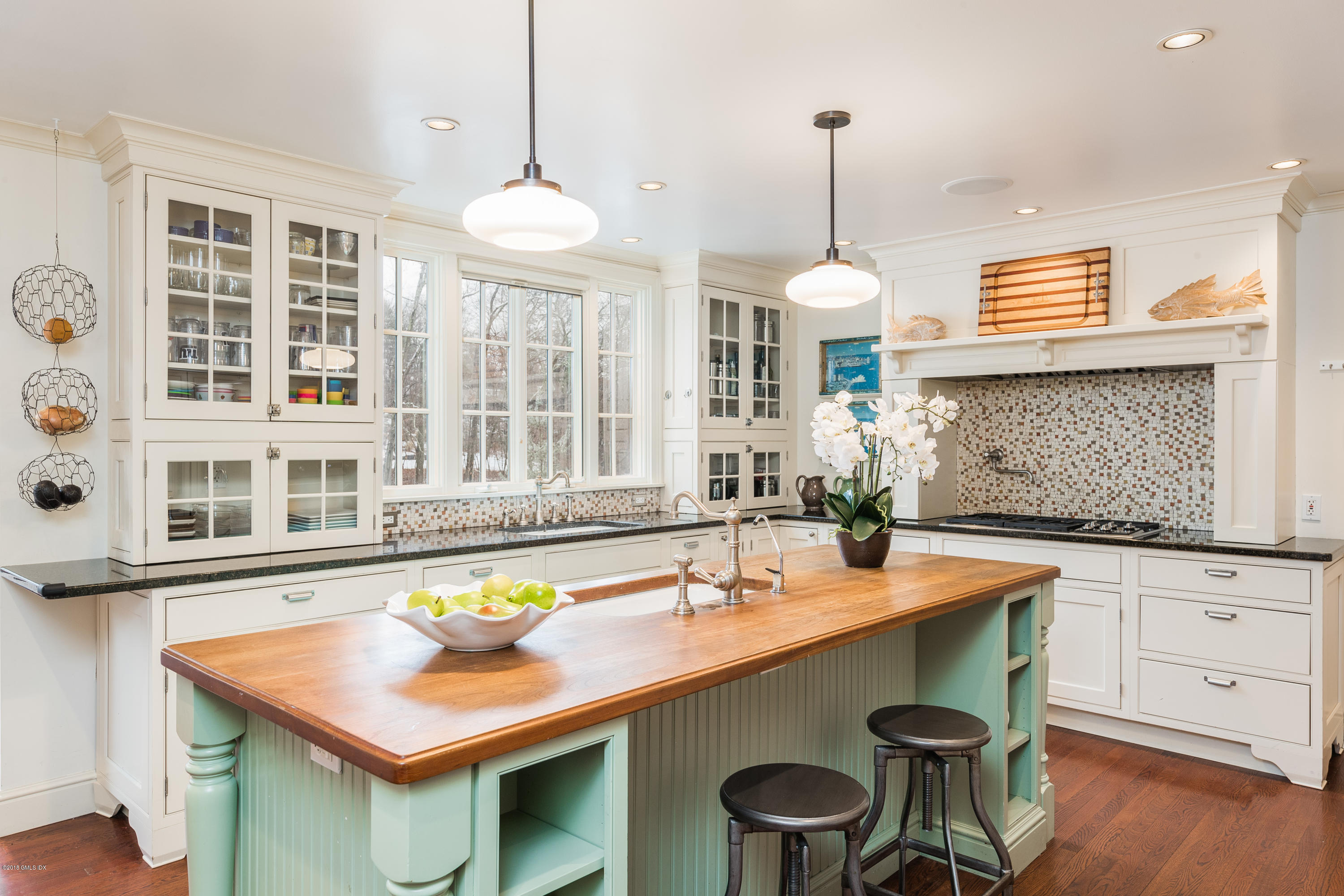 63 Burning Tree Road Greenwich, CT 06830 - Photo 10 of 40 a dining table with chairs and window