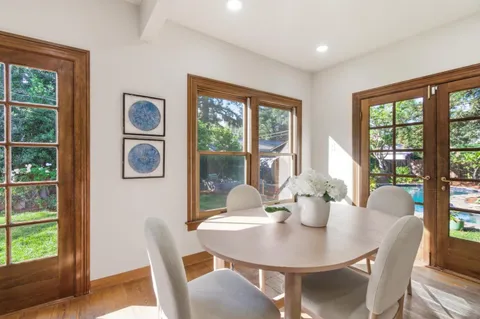 a view of a dining room with furniture window and outside view
