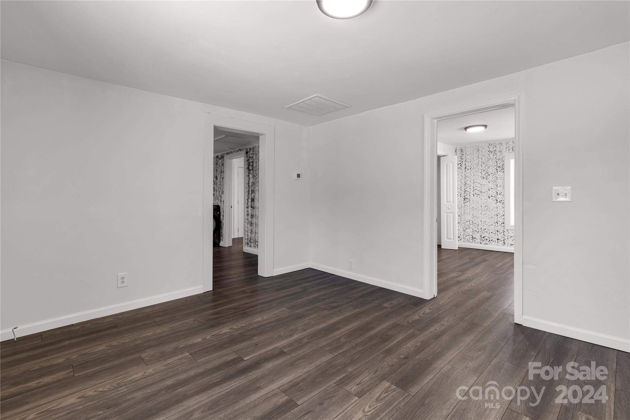 1439 Old Landsford Road Lancaster, SC 29720 - Photo 7 of 21 an empty room with wooden floor and mirror