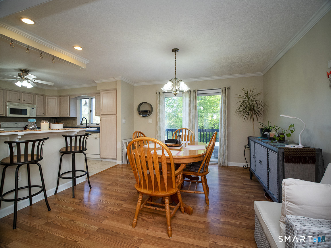82 Wilcox Road Middletown, CT 06457 - Photo 13 of 27 a view of a dining room with furniture window and wooden floor