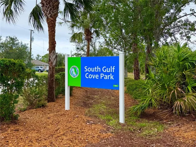 a sign that is next to a road