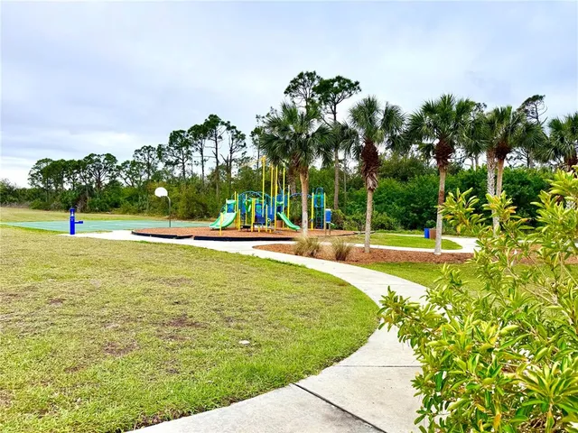 a view of a swimming pool with an outdoor space and seating area
