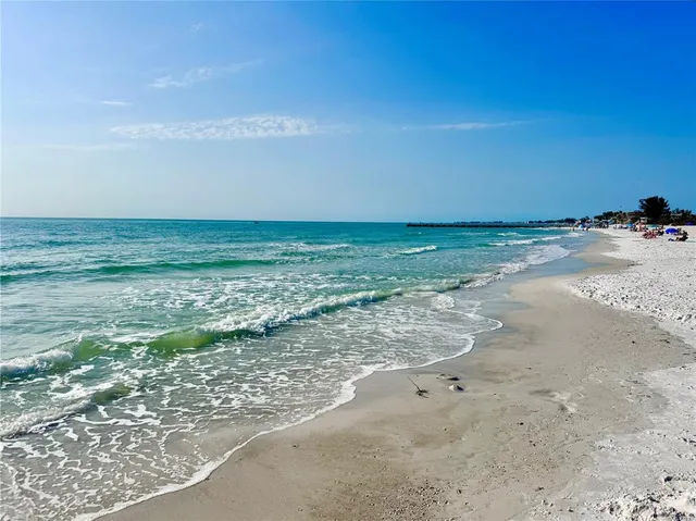 a view of a terrace with a table and chairs and potted plants