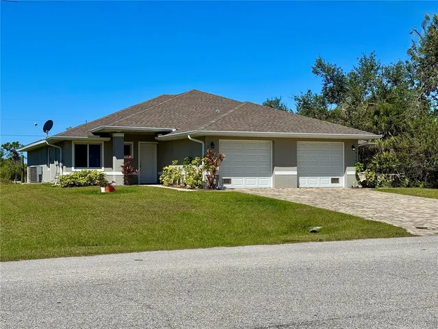a house that has a big yard with wooden fence
