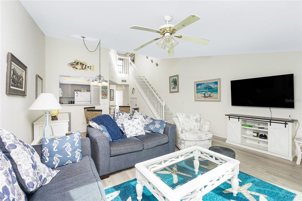 2255 North Beach Road, Unit 13 Englewood, FL 34223 - Photo 18 of 69 a living room with furniture and a flat screen tv