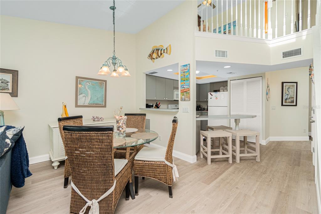 2255 North Beach Road, Unit 13 Englewood, FL 34223 - Photo 19 of 69 a dining room with furniture and window