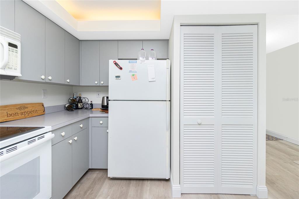 2255 North Beach Road, Unit 13 Englewood, FL 34223 - Photo 23 of 69 a white refrigerator freezer sitting inside of a kitchen