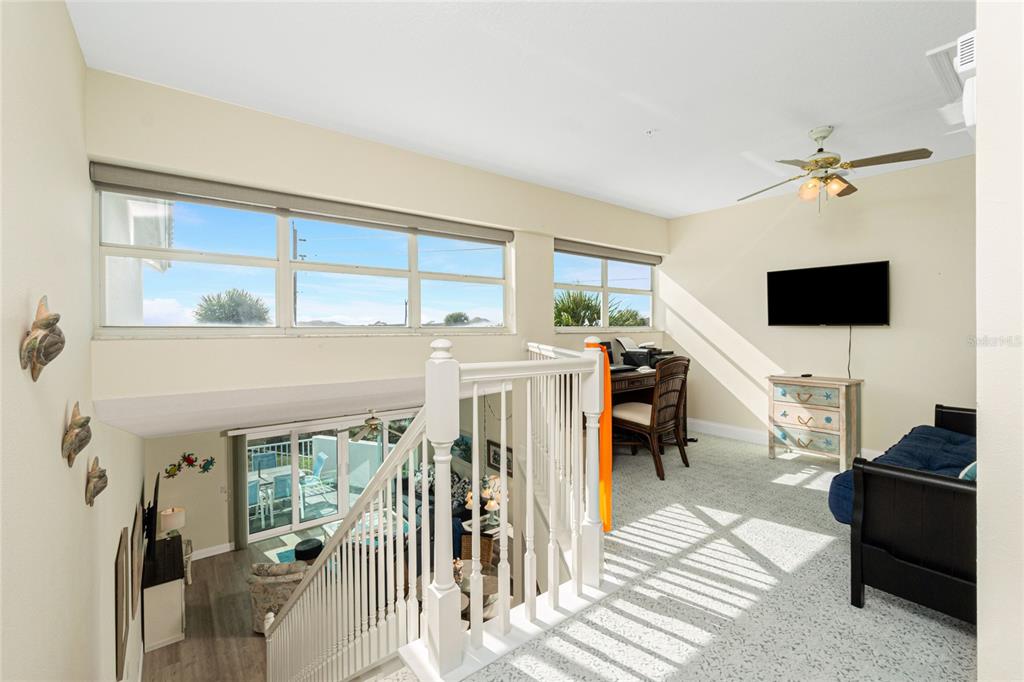 2255 North Beach Road, Unit 13 Englewood, FL 34223 - Photo 26 of 69 a living room with furniture and a flat screen tv