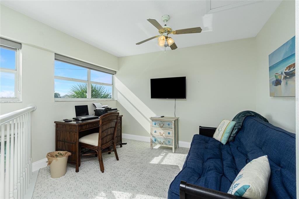 2255 North Beach Road, Unit 13 Englewood, FL 34223 - Photo 27 of 69 a living room with furniture and a flat screen tv