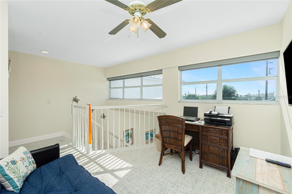 2255 North Beach Road, Unit 13 Englewood, FL 34223 - Photo 29 of 69 a workspace with furniture window and wooden floor