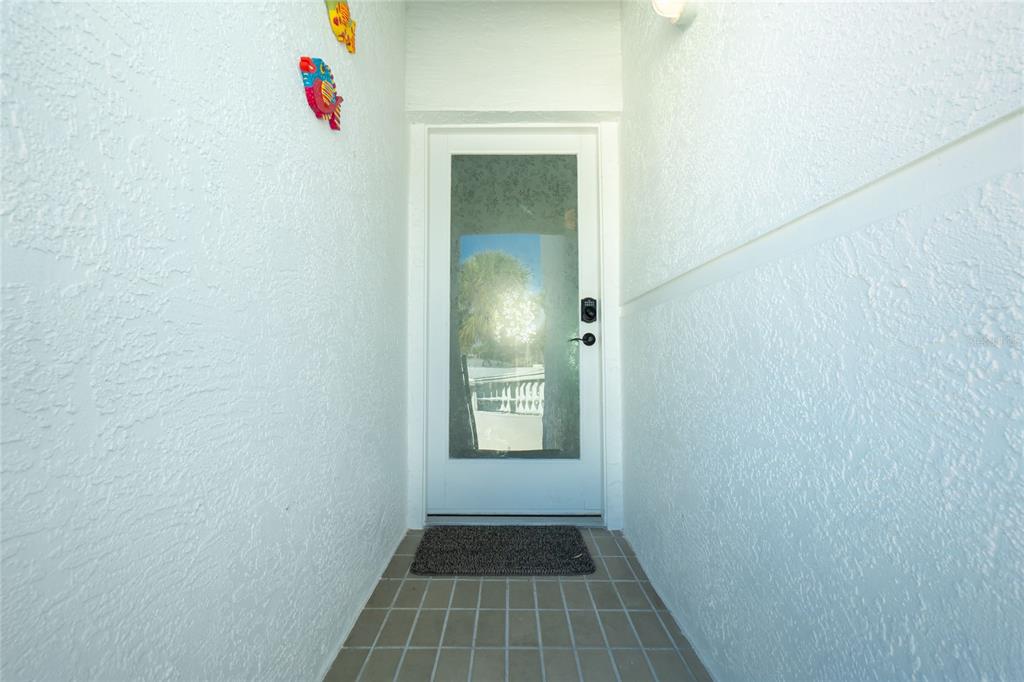 2255 North Beach Road, Unit 13 Englewood, FL 34223 - Photo 3 of 69 a view of an entryway door