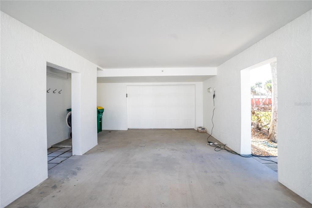 2255 North Beach Road, Unit 13 Englewood, FL 34223 - Photo 42 of 69 an empty room with an entryway and window