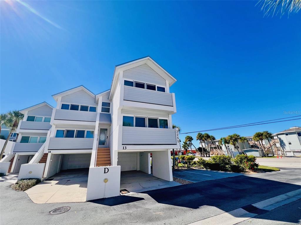 2255 North Beach Road, Unit 13 Englewood, FL 34223 - Photo 44 of 69 a view of a house with a yard