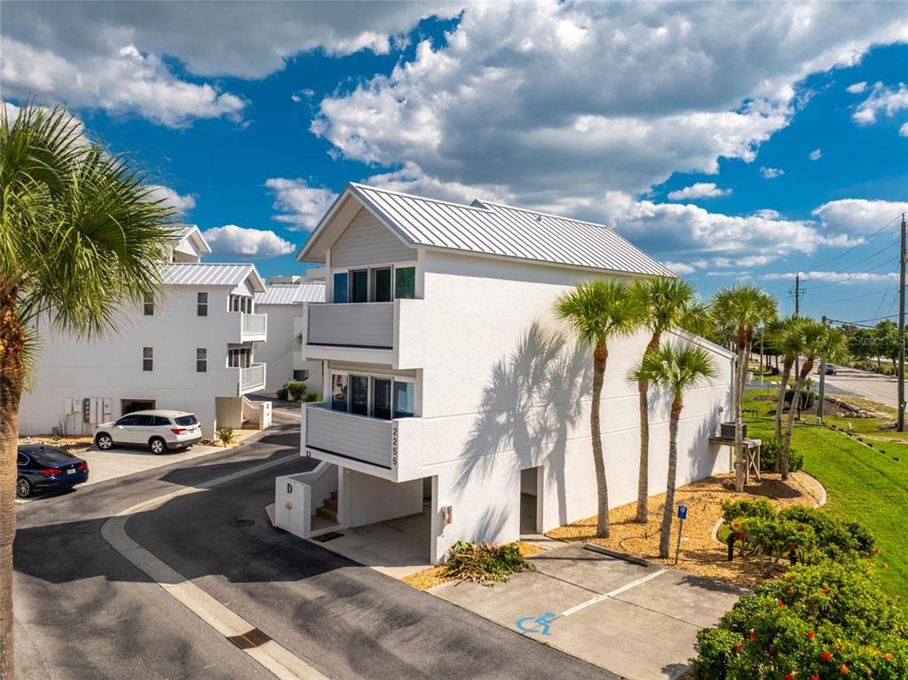 2255 North Beach Road, Unit 13 Englewood, FL 34223 - Photo 59 of 69 a view of a house with a yard