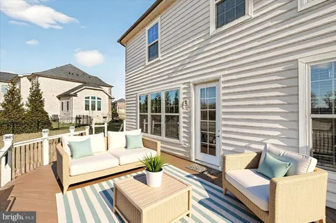 a spacious bathroom with a tub sink and mirror