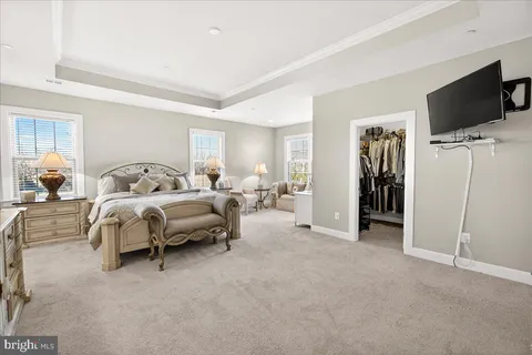 a bedroom with a bed and a chair