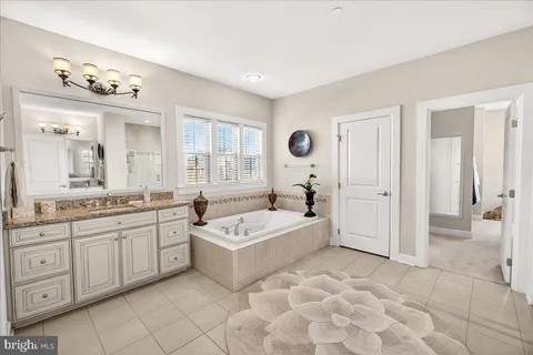 a utility room with sink dryer and washer