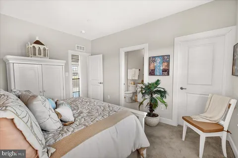 a living room with furniture gym equipment and a window