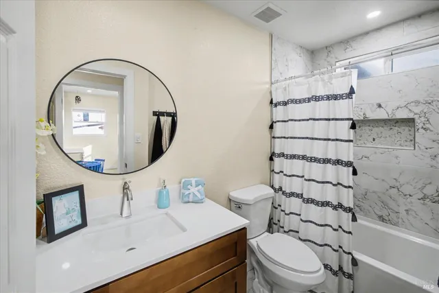 a bedroom with a bed and a workspace