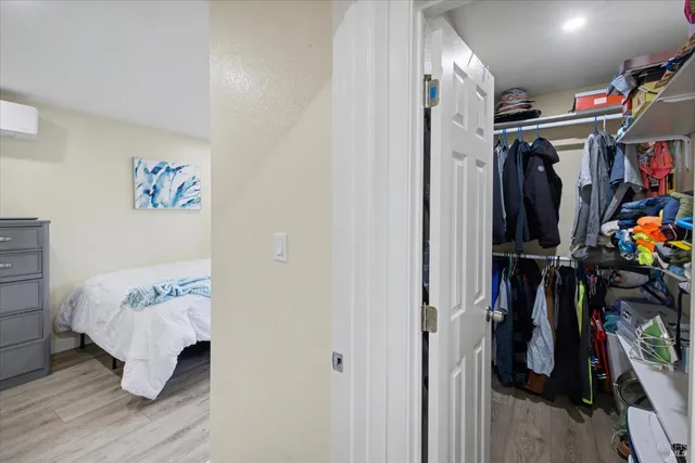 a view of a backyard with a chair and wooden fence