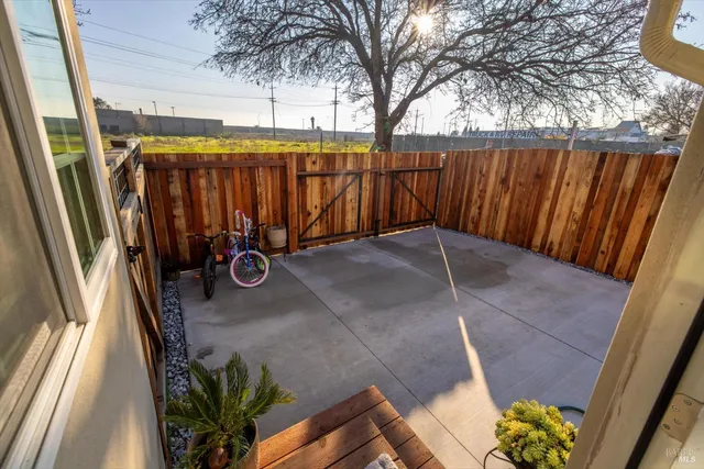 a view of outdoor space with wooden fence