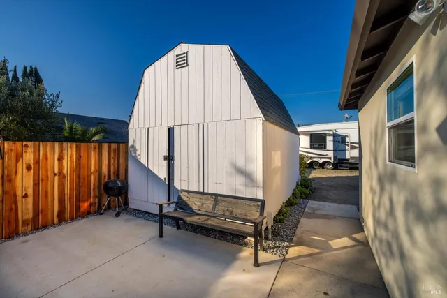 a view of a house with a backyard and a garage