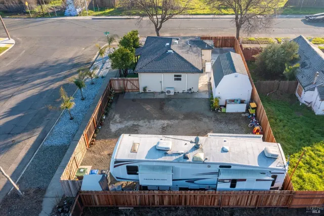 an aerial view of residential houses with outdoor space