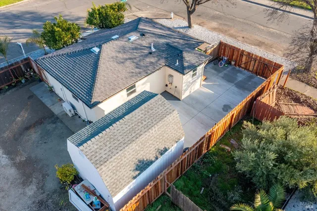 an aerial view of residential houses with outdoor space