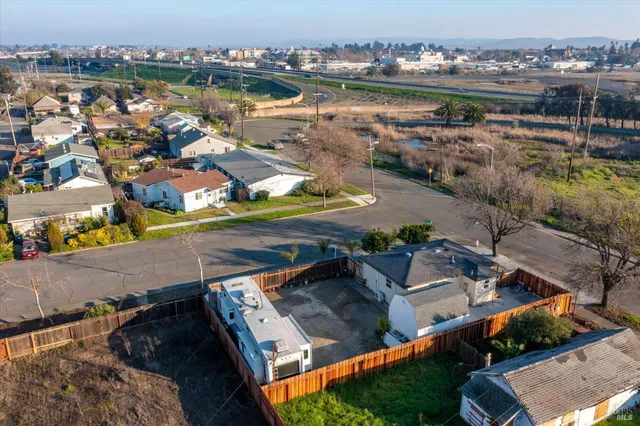 a view of a house with wooden fence