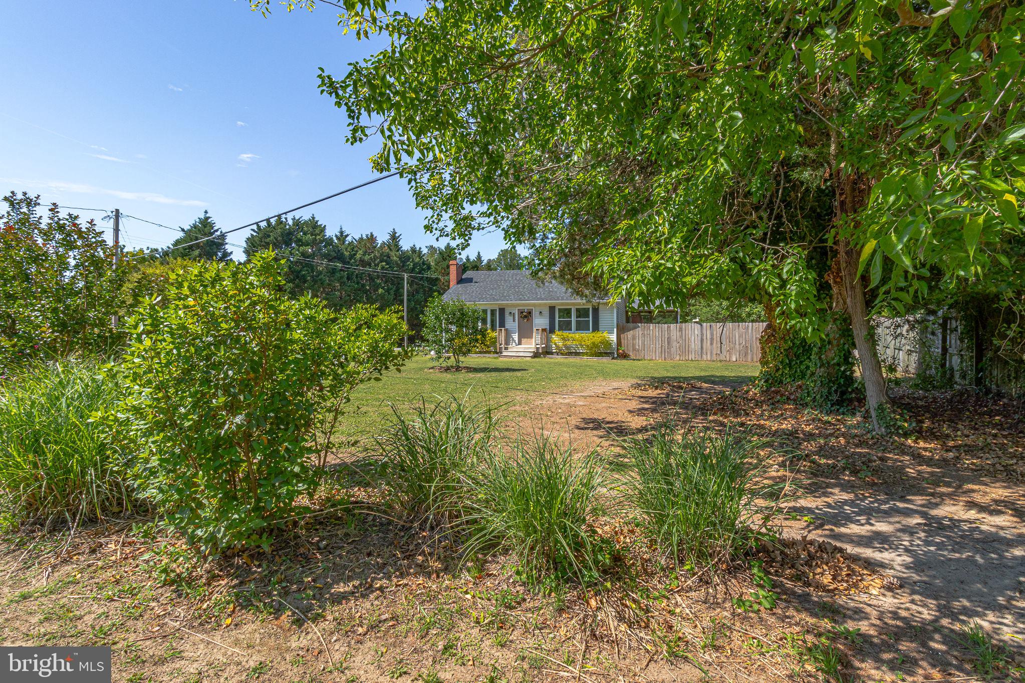 9832 River Road Lancaster, VA 22503 - Photo 65 of 68 Charming home nestled in lush greenery.
