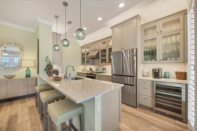 a kitchen with a sink and a refrigerator