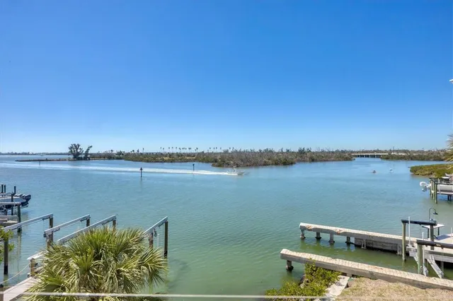 a bathroom with a granite countertop sink a mirror and a toilet