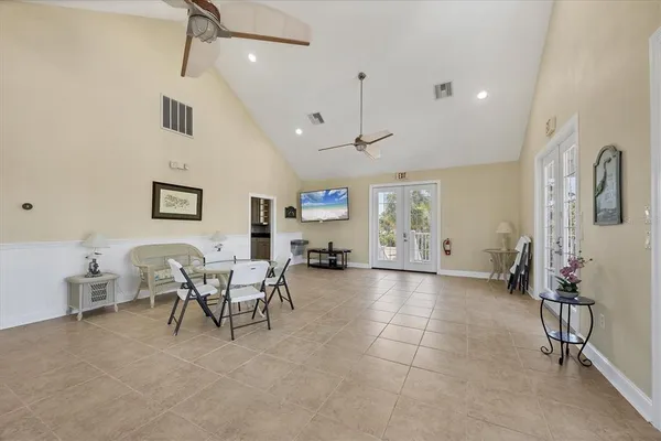 a living room with furniture a dining table and chairs
