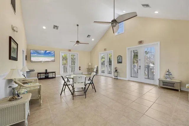 a kitchen with granite countertop white cabinets sink and stainless steel appliances