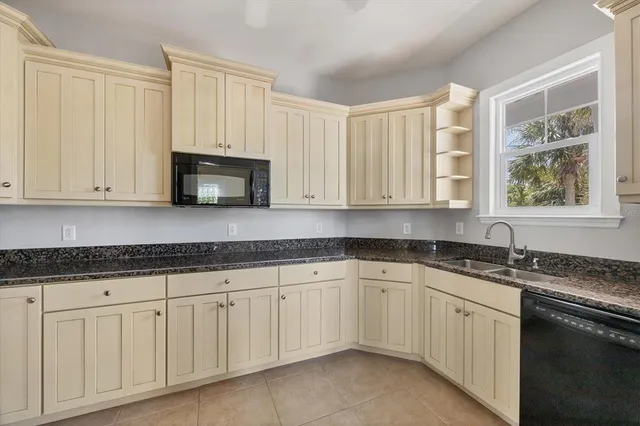 a view of swimming pool with outdoor seating and plants